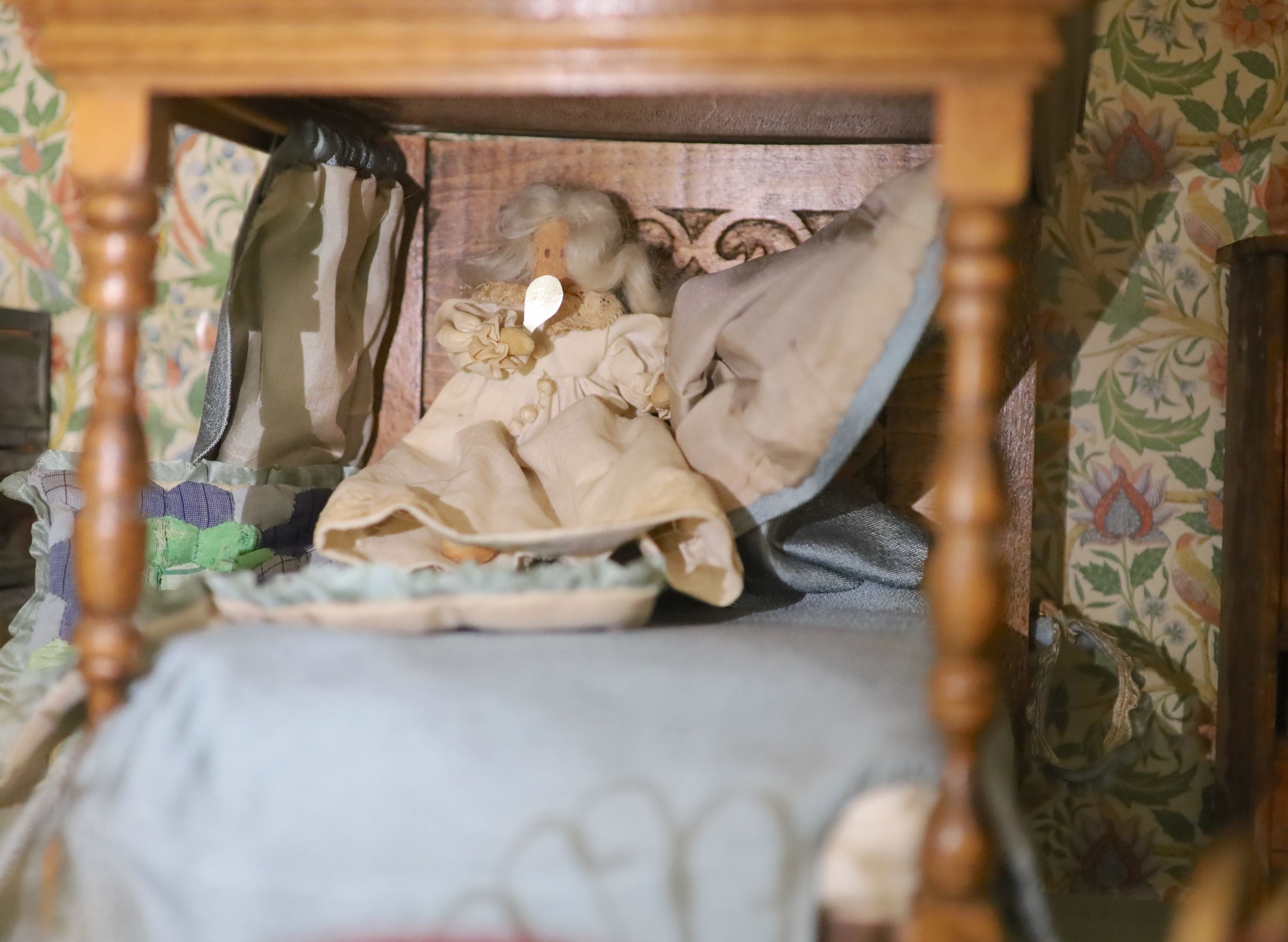 An unusually large painted pine doll's house, modelled upon a Victorian lodge house, Estate Carpenter made, Lake District width 198cm height 156cm